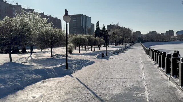 Snow-covered embankment on a sunny frosty day