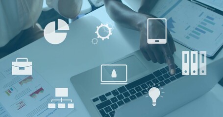 Pointing right-hand guiding laptop trackpad at desk, white sleeve, tablet and reports with icons