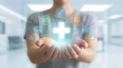 A person's cupped hands are gently holding a radiant, glowing medical cross at the center, surrounded by an orbiting array of colorful healthcare icons