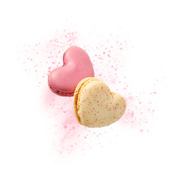 Two sweet macarons in heart shape flying isolated on white background.  Romantic love or pastry shop card element with copy space.
