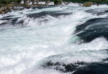 Rhine falls powerful water flowing over rocks switzerland