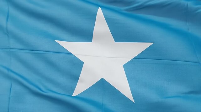 somali flag waving blue fabric with white star closeup