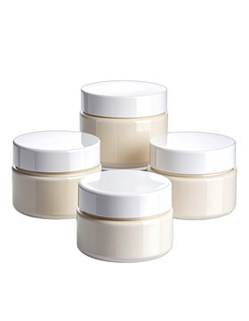 Four cosmetic cream jars with white lids against a black background.