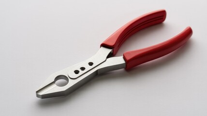 Obraz premium Red handled wire stripper and crimper tool, silver metal, isolated on white