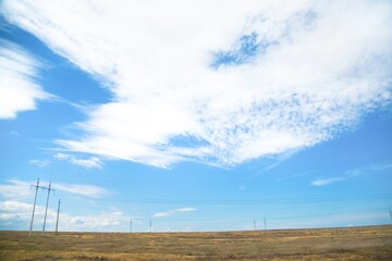 Obraz premium Beautiful hilly landscape in the foreground with blue sky