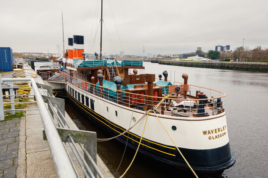 Glasgow Scotland: 26th Nov 2025: Glasgow PS Waverley steam ship docked at the river with city views in the background during an overcast day