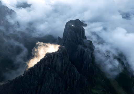 Misty Mountain Peak with Dramatic Cloud Formations