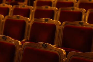 Vintage Red Velvet Theater Seats With Numbered Plaques