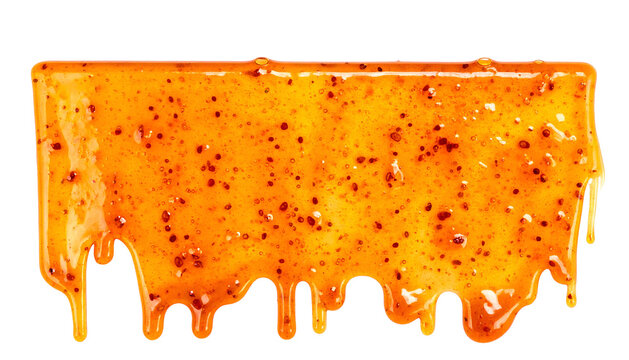A rectangular block of golden-orange food, glistening with drips against a black background