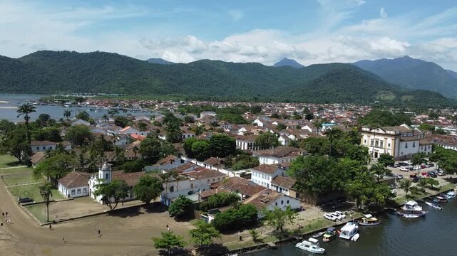 Vertical drone reveal of Paraty, with the river, the mountains and the Atlantic forest that surrounds this picturesque city