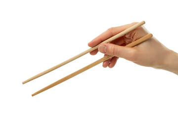 Hand holding wooden chopsticks isolated on white background