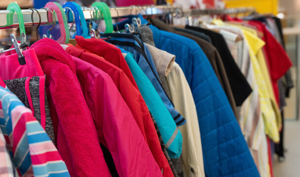 Colorful clothes swap rack with hanging garments