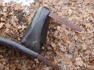 Discarded chair in nature, illegal disposal of household waste