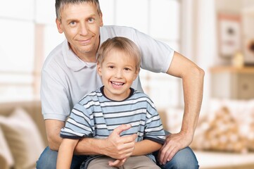 Obraz premium Happy father or grandfather with cute child at home