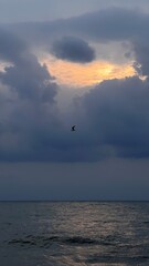 dramatic clouds over the sea at sunset