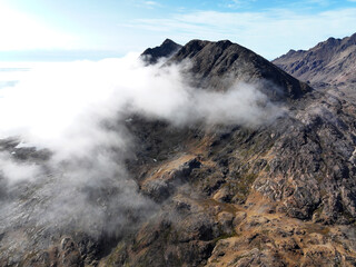 View of the waterfront infrastructure in Tasiilaq, Greenland. The clip shows the port area with shipping containers, fishing boats, and local housing, highlighting life in a remote Arctic community 