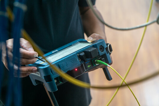 Technician Using Fiber Testing Equipment