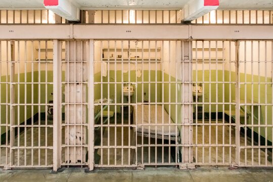 Closed prison cell doors in abandoned detention block