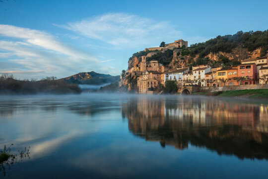 View of the beautiful village of Miravet, Tarragona, Catalonia, Spain, with the Ebro River in the foreground