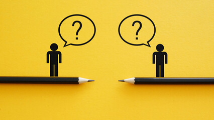 Communication Gap and Misunderstanding Concept with Question Marks Between Two People. Dialogue Breakdown, Lack of Information and Business Uncertainty © Andrii