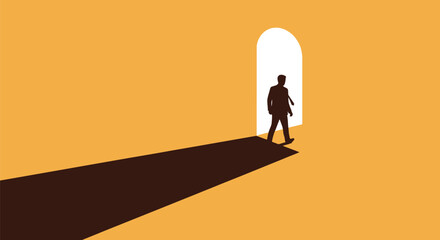 Businessman silhouette walks toward a brightly lit arched doorway casting a long shadow on the ochre floor.