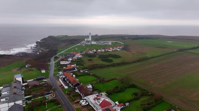 Aerial Video of Flamborough Head Yorkshire UK. Flamborough Head  is a promontory, 8 miles (13 km) long on the Yorkshire coast of England, between the Filey and Bridlington.