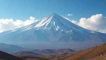 Keuken achterwand Blauw Snow capped Mount Damavand in Iran against clear blue sky with white clouds. Desert foothills in foreground. Majestic mountain landscape offers breathtaking views. Great for travel and nature themes.  © Pete