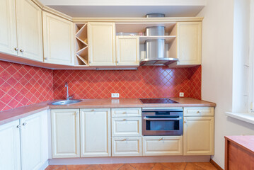 Modern Home Kitchen With Light Wooden Cabinets and Red Tiled Interior Design