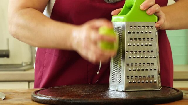Woman is peeling and cutting onions for cooking
