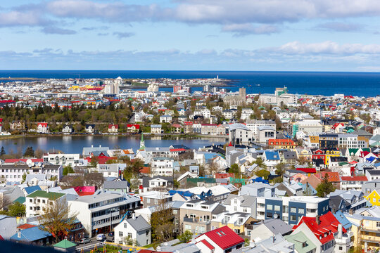 Aerial view of Reykjavik cityscape with colorful houses and Tjornin lake in Iceland.