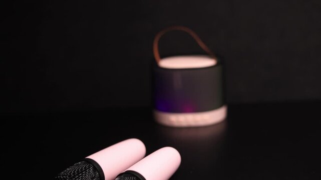 Portable Bluetooth speaker with colorful LED lights and a convenient carrying strap