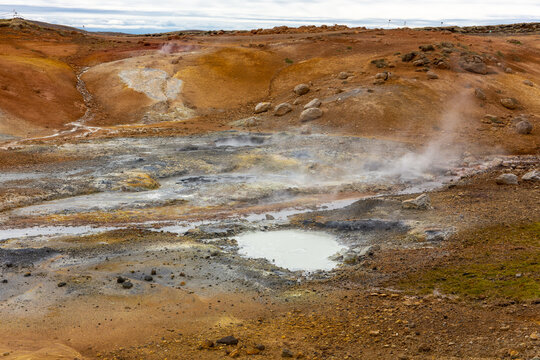 Seltun geothermal area landscape view of steaming hot spring and orange sulfur soil in Krysuvik Iceland