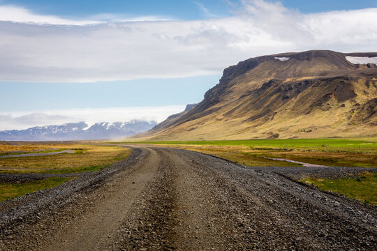 Gravel track of F249 road winding through the Thorsmork valley landscape, Iceland