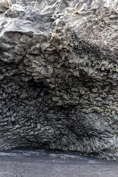 Halsanefshellir Cave basalt columns vault interior view at Reynisfjara Black Sand Beach, Iceland