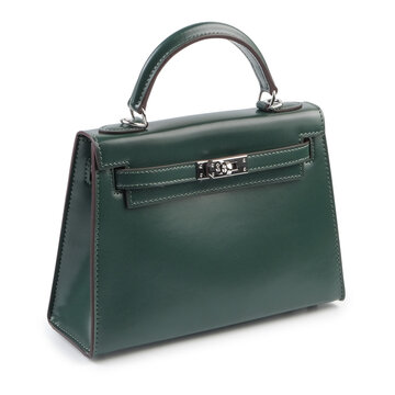 Stylish dark green leather handbag photographed on white background. Luxury women&rsquo;s fashion accessory inspired by classic Birkin design, symbol of elegance, minimalism, and premium quality.