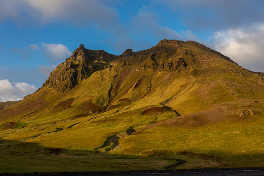 Sunset light on a rugged volcanic mountain ridge along the Ring Road near Vik i Myrdal, Iceland
