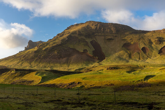 Volcanic mountain ridge with landslide scars at sunset near Vik i Myrdal, Iceland