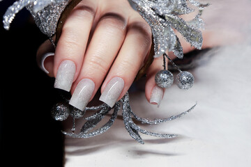 Beautiful manicure with a silver shimmer.