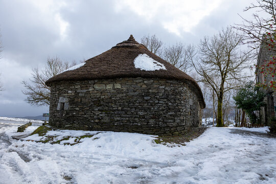 Palloza stone house in o cebreiro covered in snow