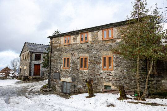O cebreiro village with traditional stone houses covered in snow