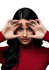 Ultra close-up portrait of a young woman in a high-neck crimson top, raven hair defined by rim light, playfully peeking through fingers against a deep burgundy backdrop. concept of intimate secrecy