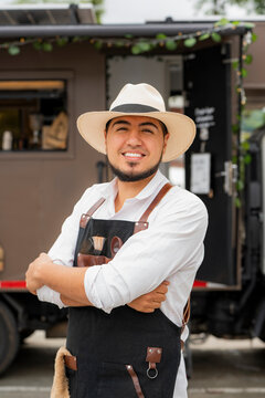 Coffee truck vendor smiling by his motorhome