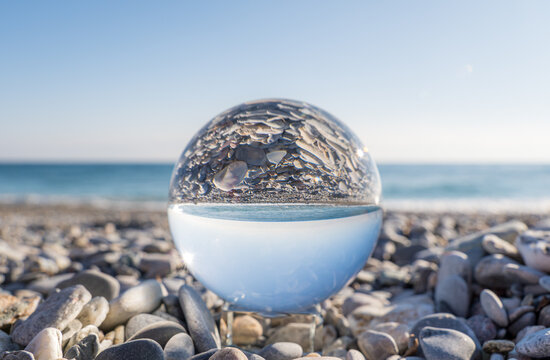 Crystal ball capturing a unique seaside view