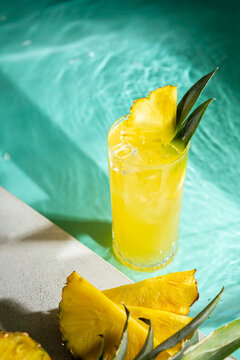 Refreshing pineapple cocktail by the pool