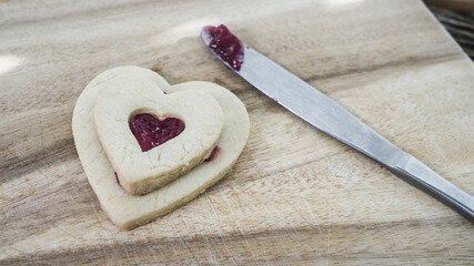 Heart shaped cookies with jam filling preparing