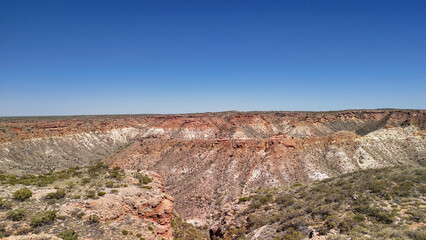 Aerial view of the road to Exmouth, Western Australia, surrounded by termite hills and arid landscape