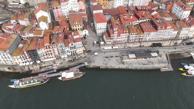 Top Down Aerial Flyover of Ribeira Waterfront and Douro River in Porto