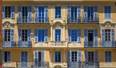 Plexiglas schilderij Nice Traditional houses with ornate metal work and shutters in the streets of Old Town Vielle Ville in Nice, South of France  © SvetlanaSF