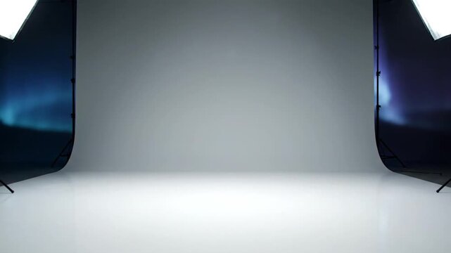 Professional photography studio setup with softbox lights and gray background