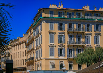Fototapeta premium Traditional houses with ornate metal work and shutters in the streets of Old Town Vielle Ville in Nice, South of France